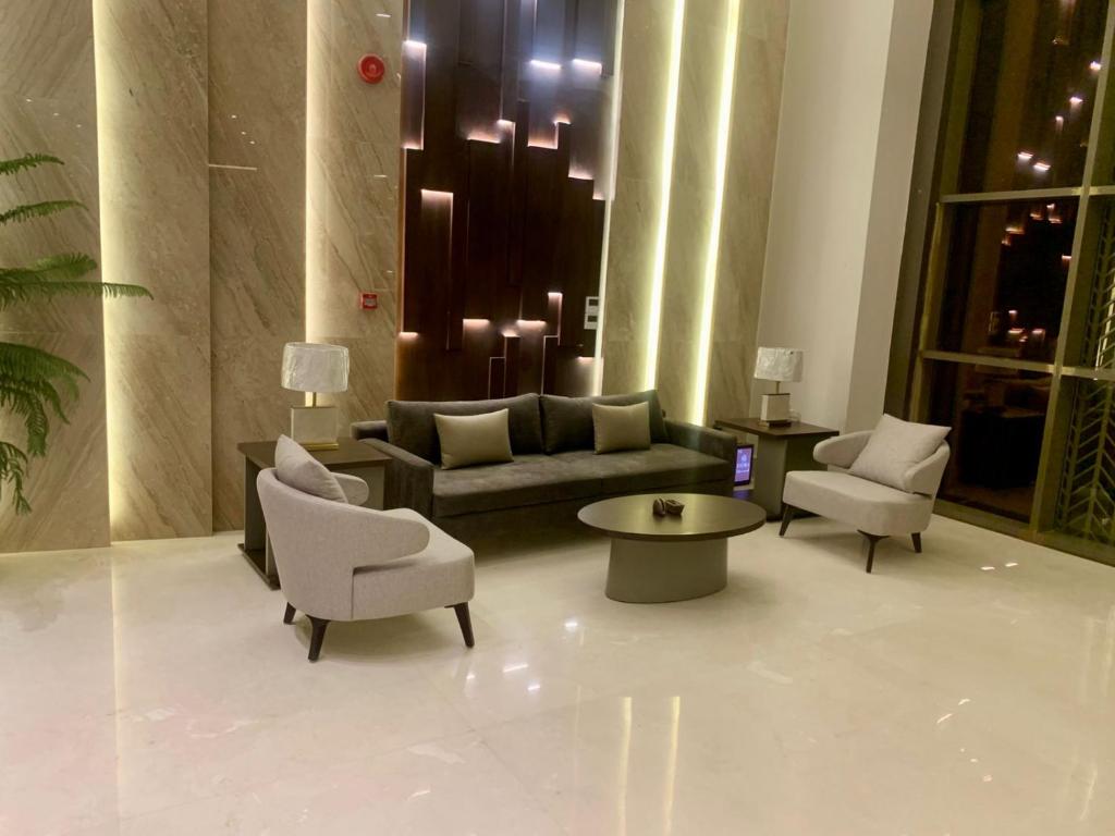 a living room with a couch and chairs and a table at فندق ليورا Liora Hotel in Riyadh