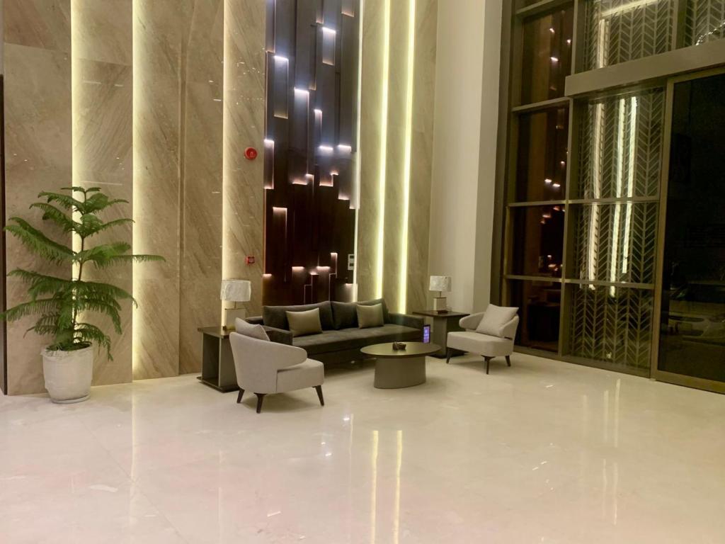 a lobby with a couch and chairs in a building at فندق ليورا Liora Hotel in Riyadh
