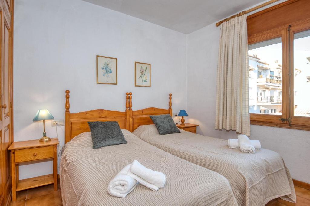 Postel nebo postele na pokoji v ubytování Apartaments Can Niell