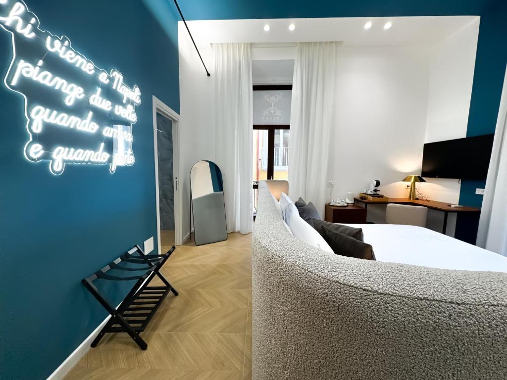 a bedroom with a bed and a room with a desk at Toledo LR Collection in Naples