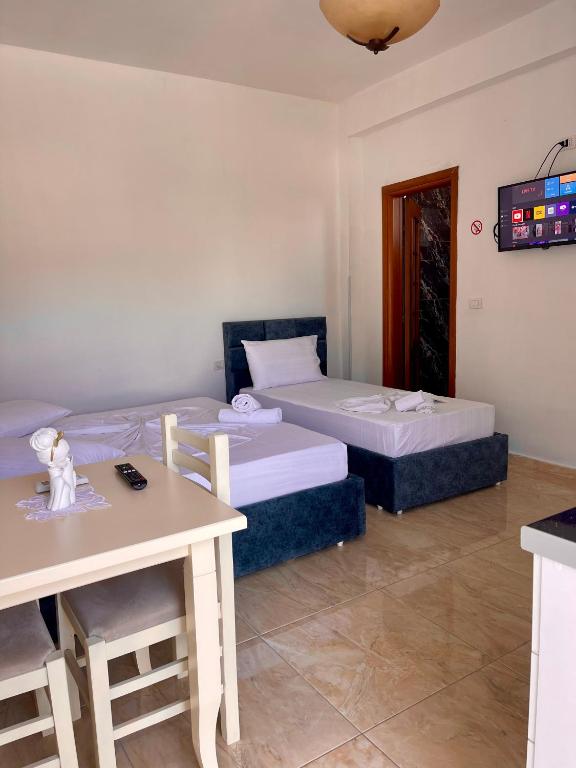 Postel nebo postele na pokoji v ubytování Kristeo`s Apartaments