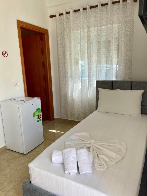 Postel nebo postele na pokoji v ubytování Kristeo`s Apartaments
