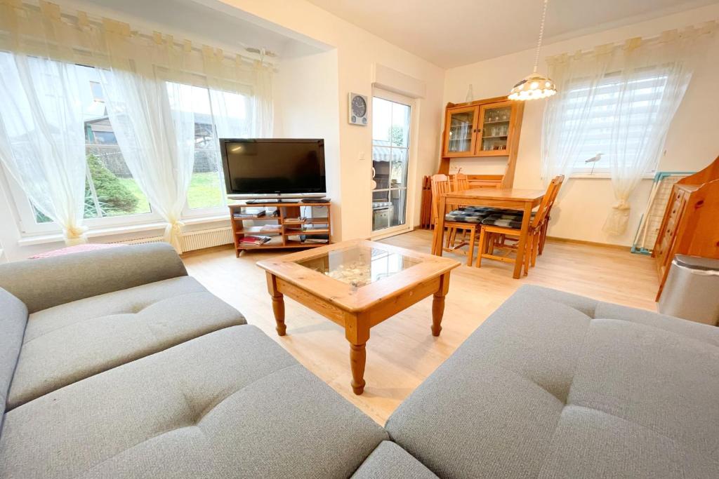 a living room with a couch and a coffee table at Ferienhaus Anja 3 in Ueckeritz