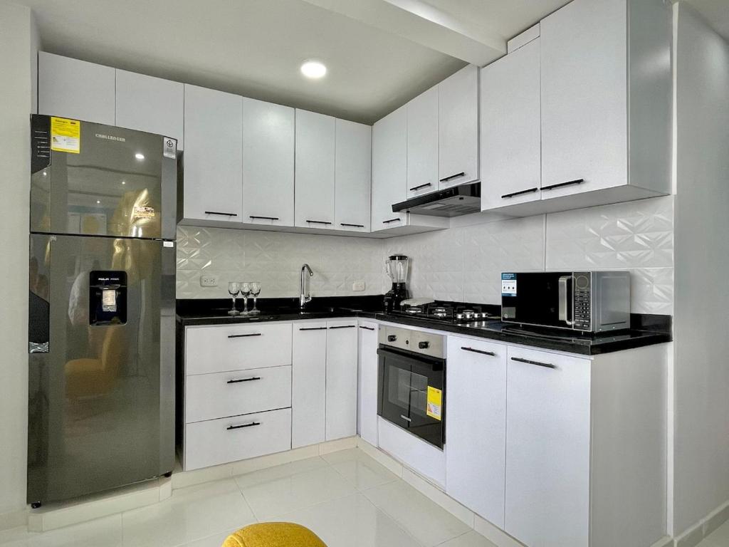 Kuchyň nebo kuchyňský kout v ubytování Apartamento con vista única cerca de la Uninorte