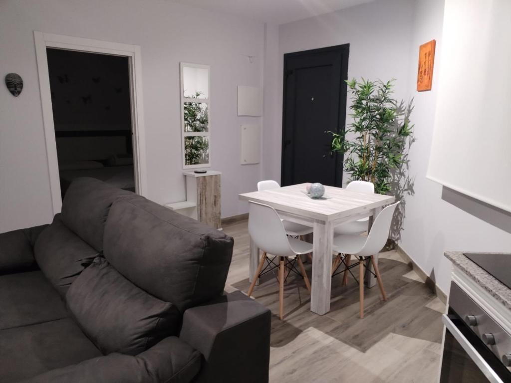 a living room with a couch and a table at Castralvo Suites in Teruel