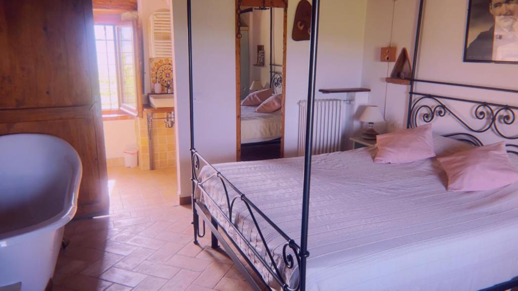 Postel nebo postele na pokoji v ubytování Monte Paradiso Agriturismo