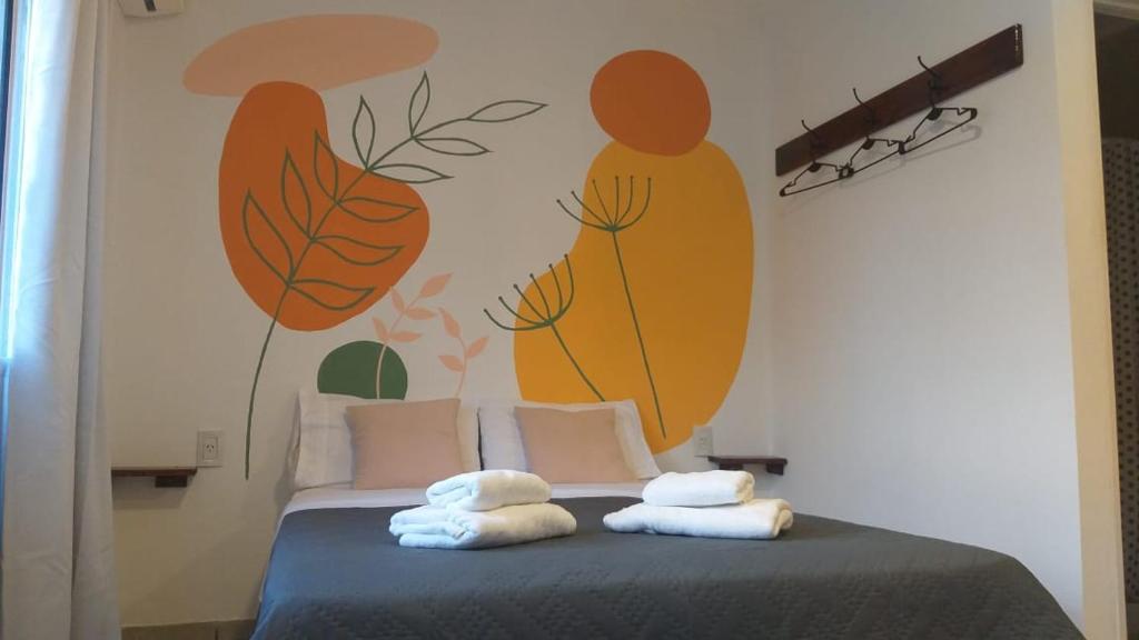 Ένα ή περισσότερα κρεβάτια σε δωμάτιο στο Hospedaje Ramallo