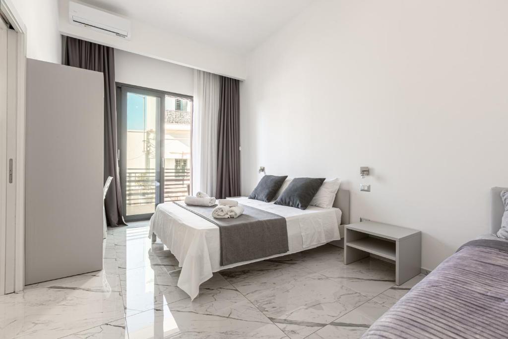 A bed or beds in a room at La Corte dei Pozzi