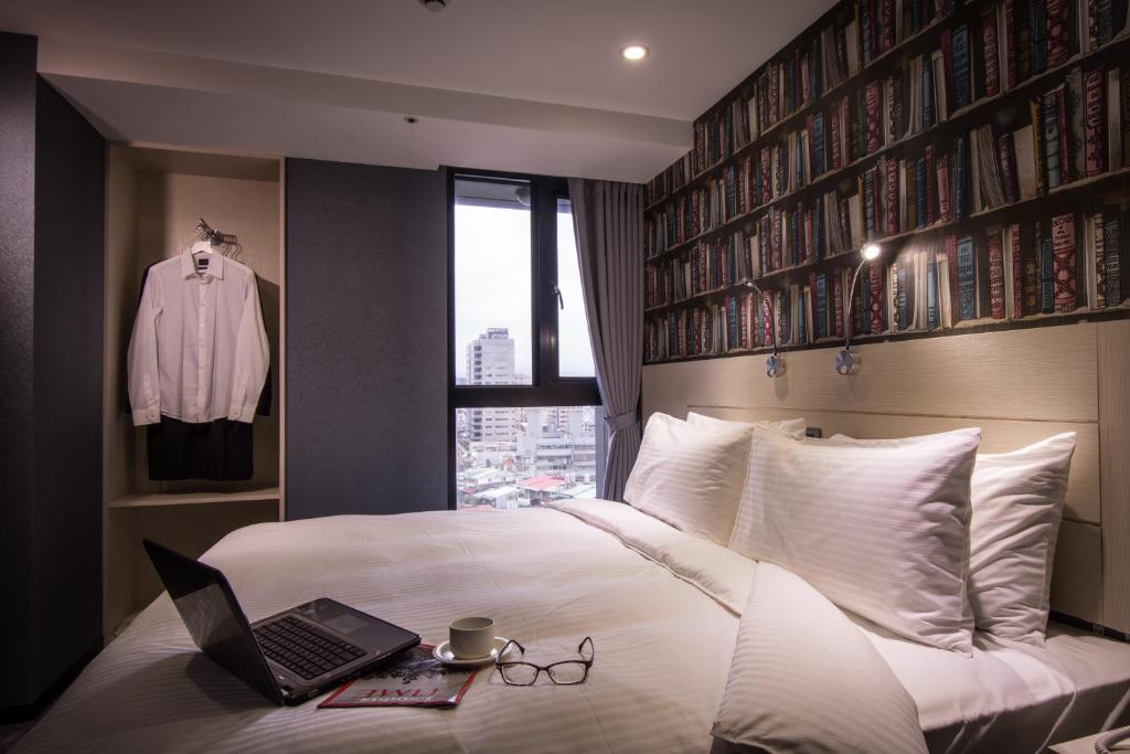 Postel nebo postele na pokoji v ubytování Yi Su Hotel-Taipei Ningxia
