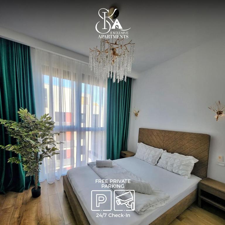 a bedroom with a large bed and a chandelier at Sika Prestige Apartment - cazare premium Arad - self check-in in Arad