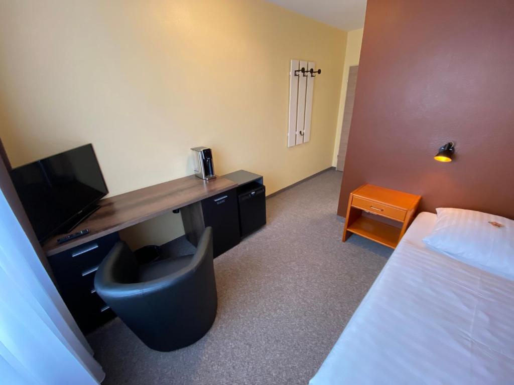 Postel nebo postele na pokoji v ubytování Adamidis Hotel