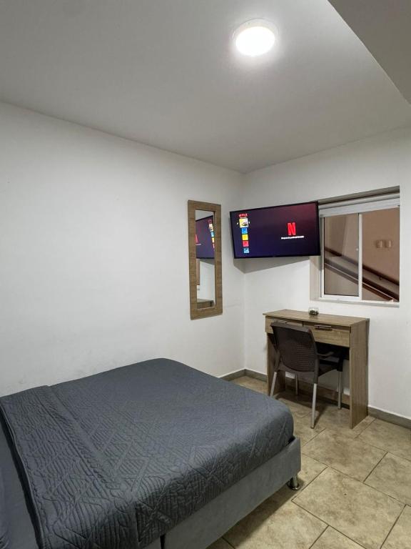 Postel nebo postele na pokoji v ubytování Hostelfc San Luis