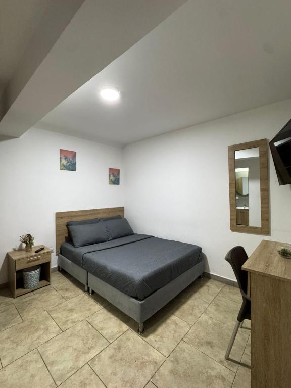TV a/nebo společenská místnost v ubytování Hostelfc San Luis