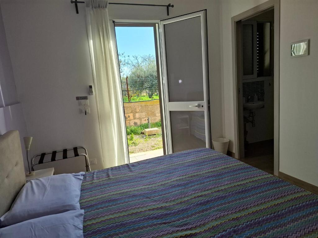 Posteľ alebo postele v izbe v ubytovaní Turtle Island Apartments