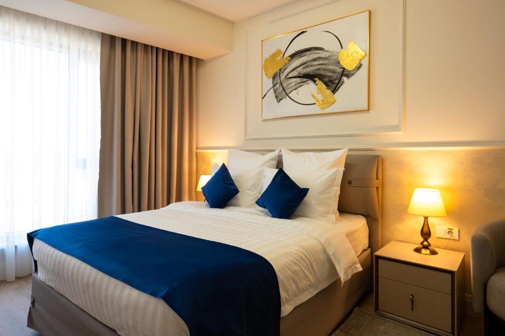 Postel nebo postele na pokoji v ubytování Le Blanc Cotroceni Hotel