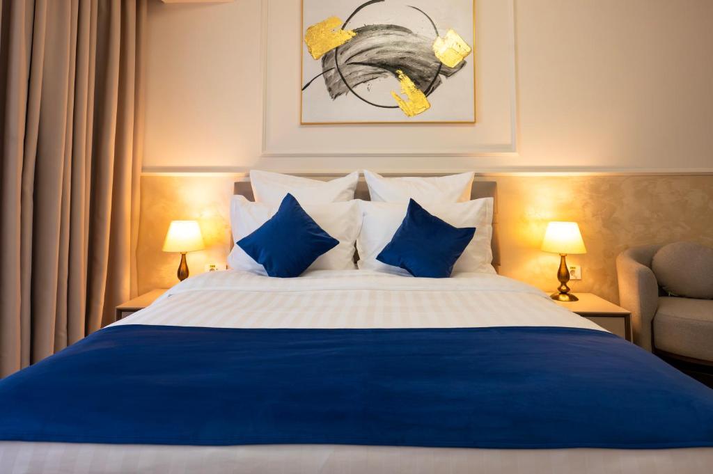 Postel nebo postele na pokoji v ubytování Le Blanc Cotroceni Hotel
