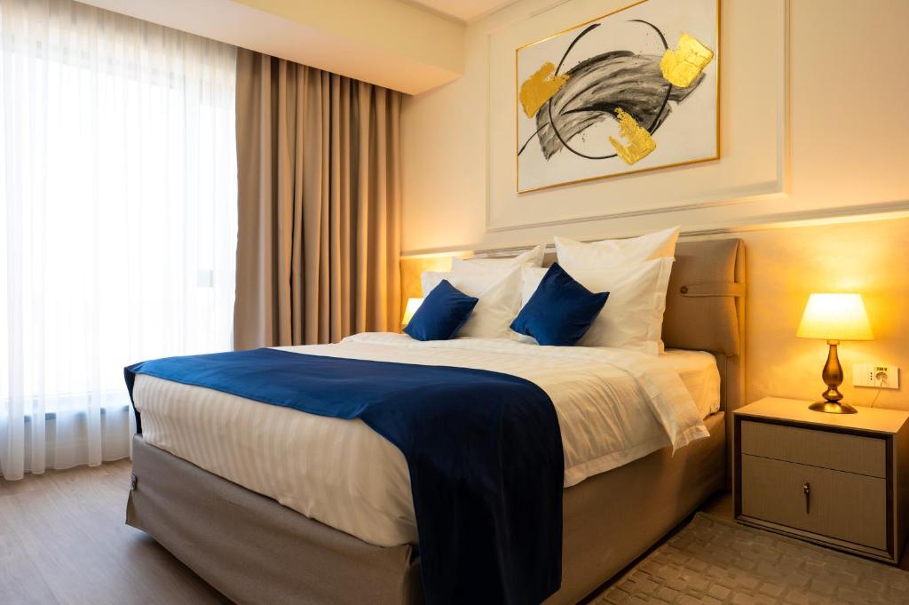 Postel nebo postele na pokoji v ubytování Le Blanc Cotroceni Hotel