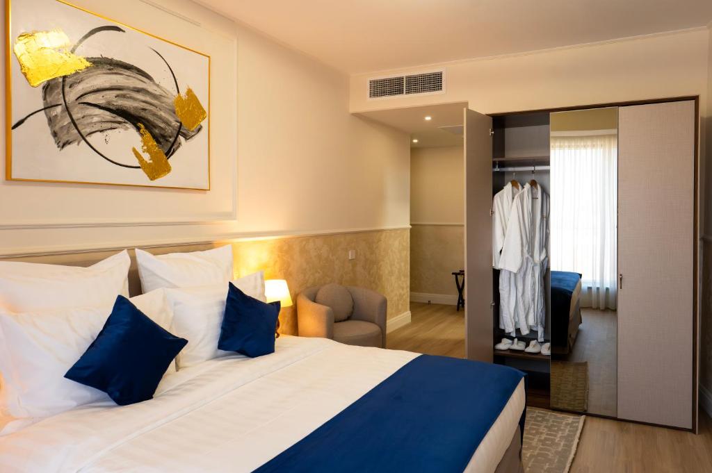Postel nebo postele na pokoji v ubytování Le Blanc Cotroceni Hotel