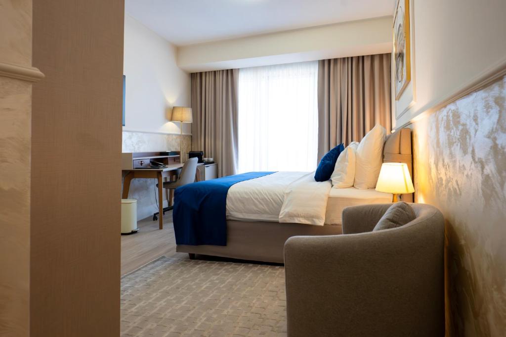 Postel nebo postele na pokoji v ubytování Le Blanc Cotroceni Hotel