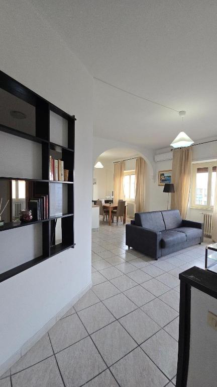 a living room with a couch and a table at M&M Apartment in Ponte Lucano