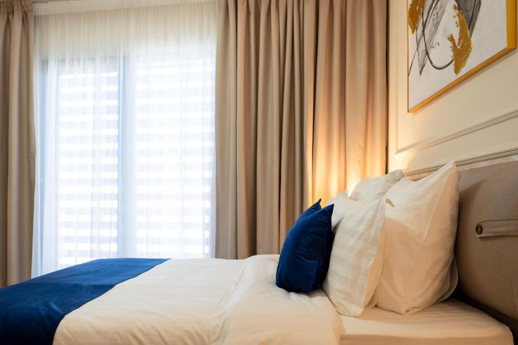 Postel nebo postele na pokoji v ubytování Le Blanc Cotroceni Hotel