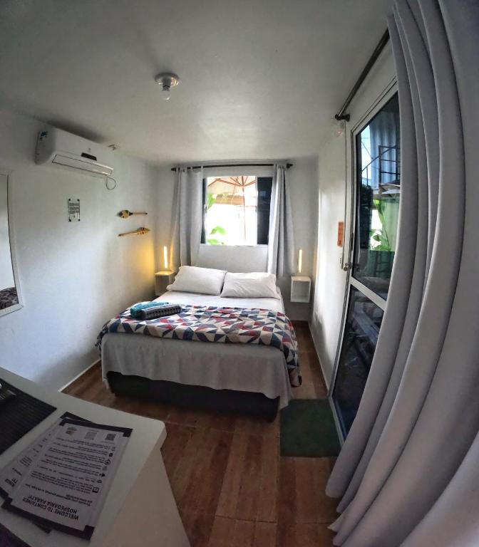 Postel nebo postele na pokoji v ubytování Container Hospedaria Paraty