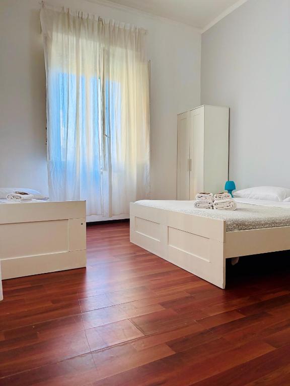 A bed or beds in a room at Castelnuovo Rooms #Politeama