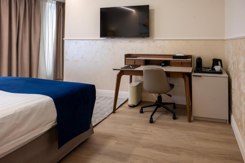 Postel nebo postele na pokoji v ubytování Le Blanc Cotroceni Hotel