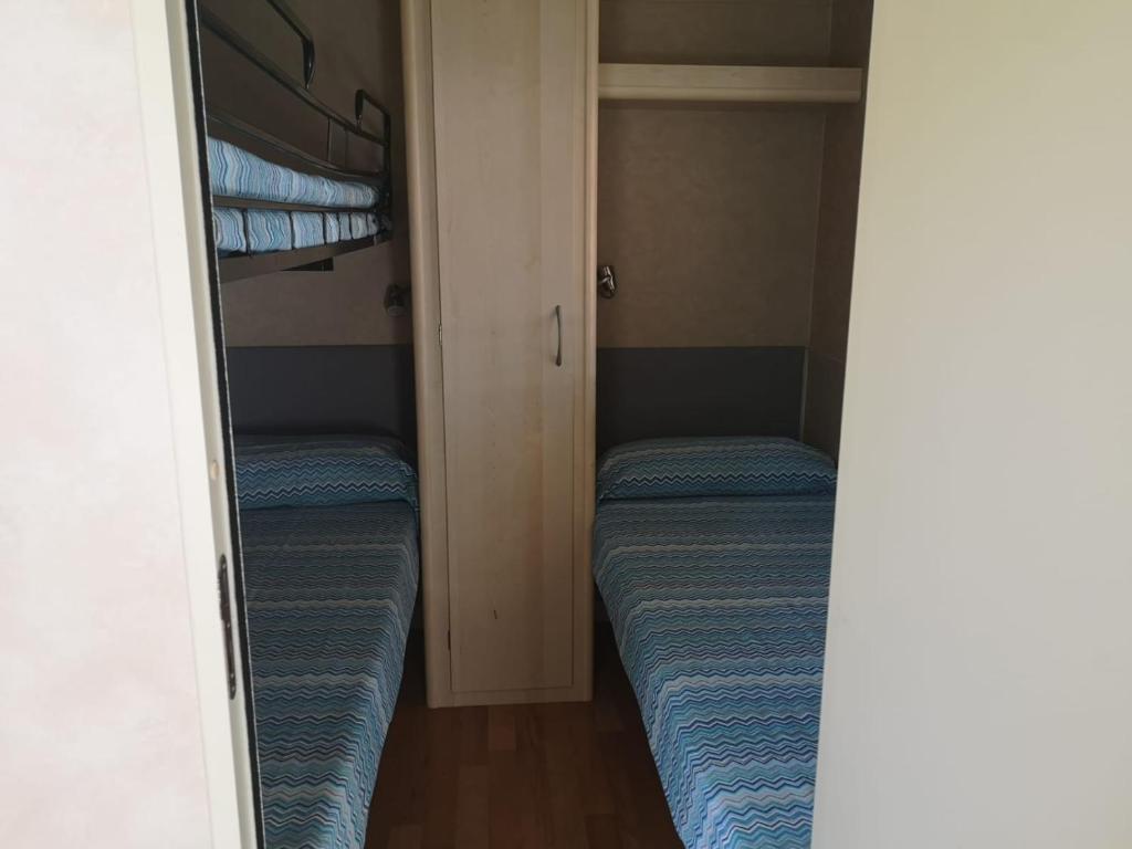 Postel nebo postele na pokoji v ubytování Camping Paradiso