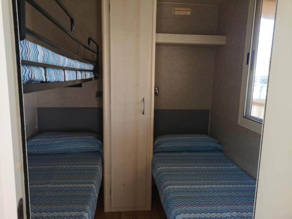Postel nebo postele na pokoji v ubytování Camping Paradiso