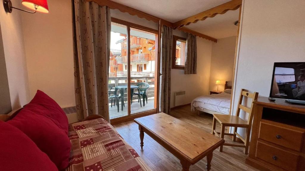 En eller flere senge i et værelse på Appartement attrayant avec balcon à Les Orres 35 m²