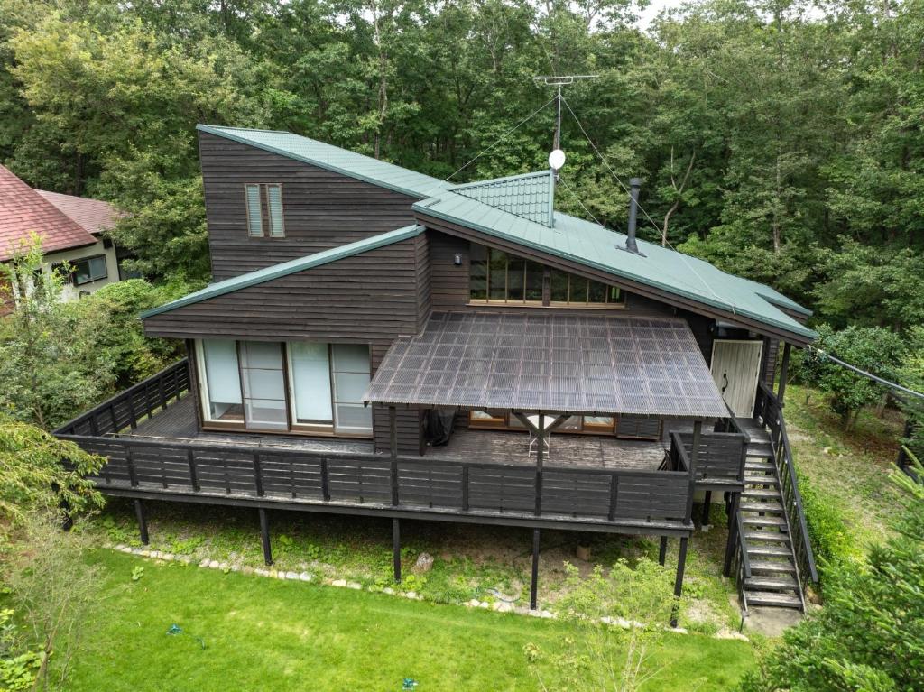 a house with a solar panel on the front of it at Nasu Premium House - Vacation STAY 17949 in Nasu-yumoto