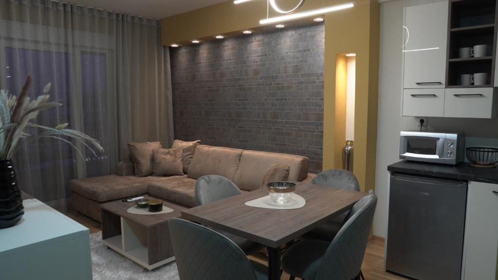 a living room with a couch and a table at Astera 2 in Vrnjci