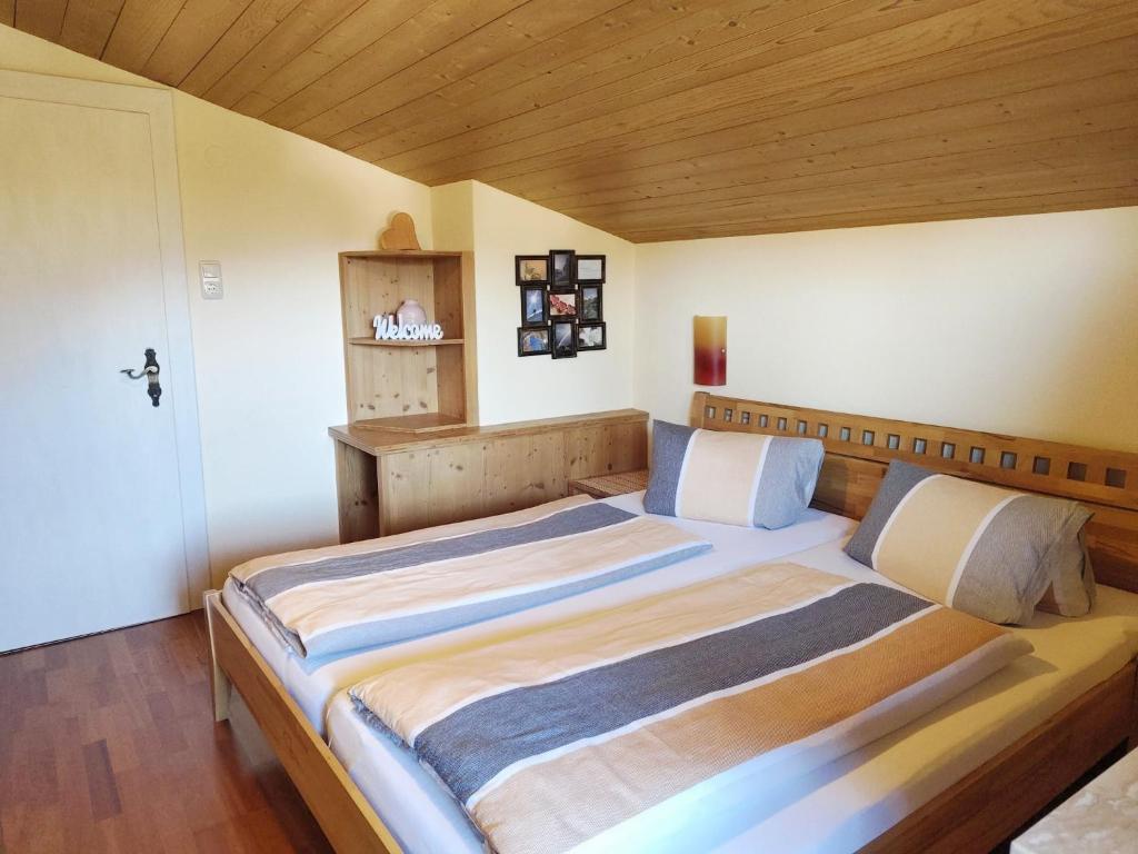 Postel nebo postele na pokoji v ubytování Gästehaus Midi