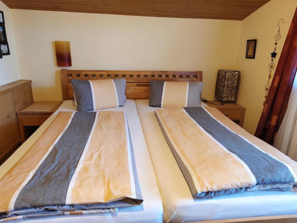 Postel nebo postele na pokoji v ubytování Gästehaus Midi