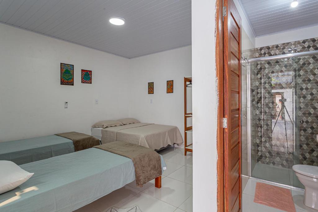 Postel nebo postele na pokoji v ubytování Pousada Muiraquitã Parintins