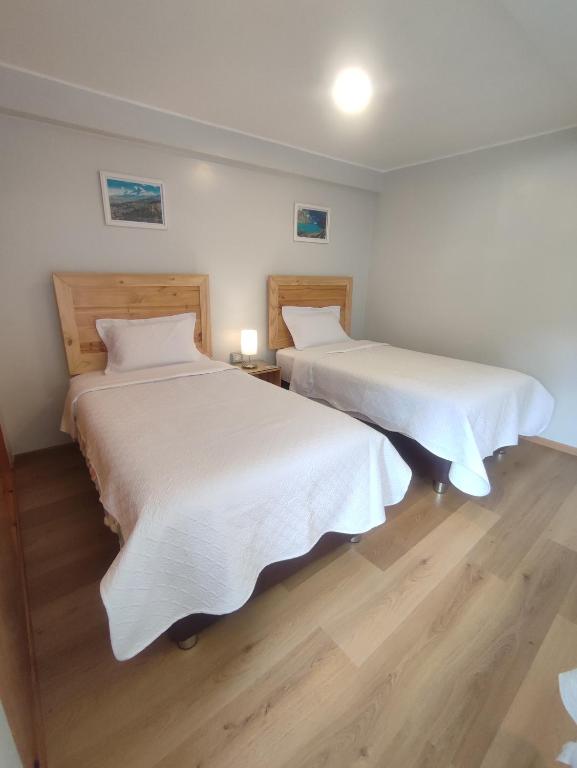 Postel nebo postele na pokoji v ubytování Casa Alojamiento Tocllaraju