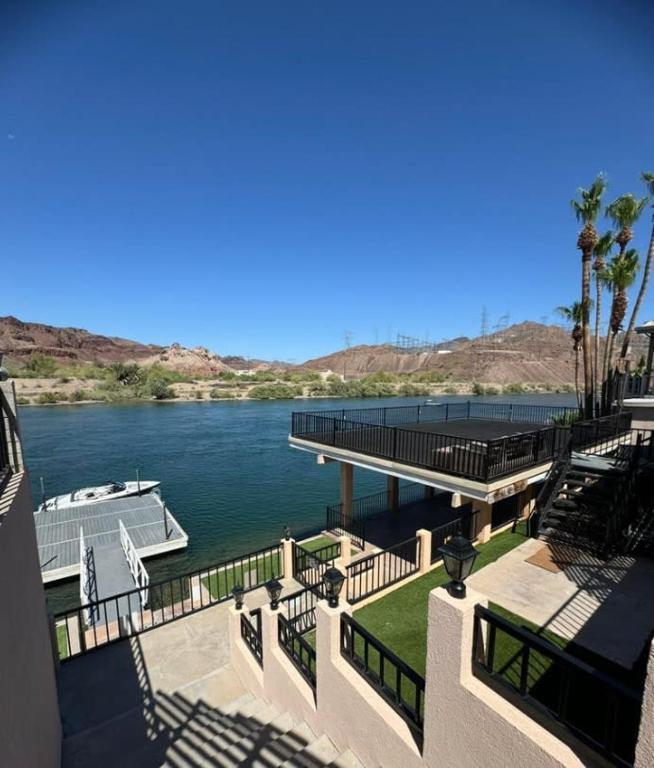 a view of a river with a dock and a boat at Cliff Hanger, River access with dock in Parker
