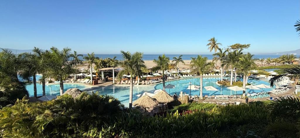 a view of the pool at a resort at Luxurious 2-Bedroom Condo in Nuevo Vallarta 