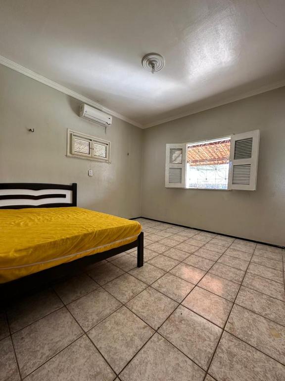 Ένα ή περισσότερα κρεβάτια σε δωμάτιο στο Casa Iguape