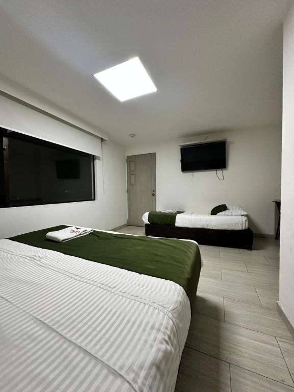 Postel nebo postele na pokoji v ubytování Hotel Bestmark Platino en Chapinero Bogota