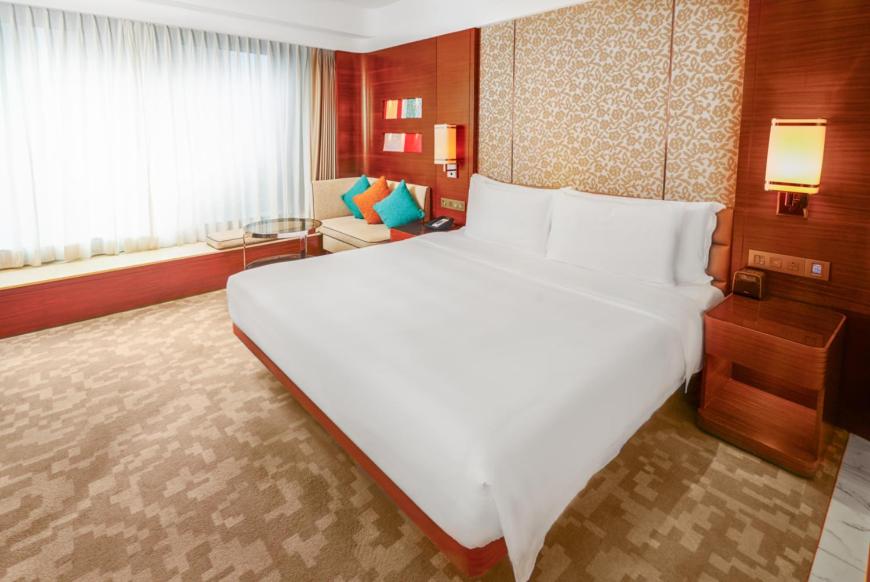 Postel nebo postele na pokoji v ubytování Crowne Plaza Macau by IHG