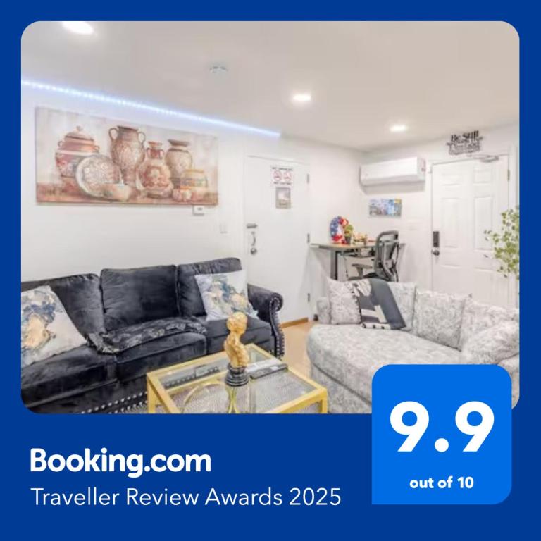a living room with a couch and a table at Exquisite 3 Bedrooms in Newark