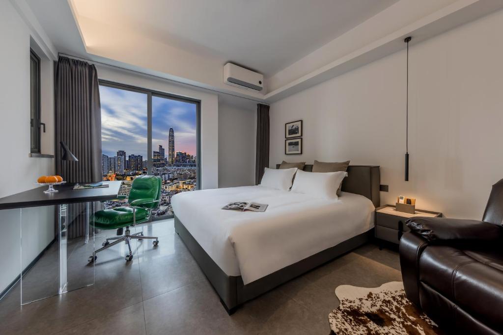 Postel nebo postele na pokoji v ubytování 枫雨酒店公寓华强北店-Fengyu Hotel Apartment Shenzhen Huaqiang North Subway Station Branch