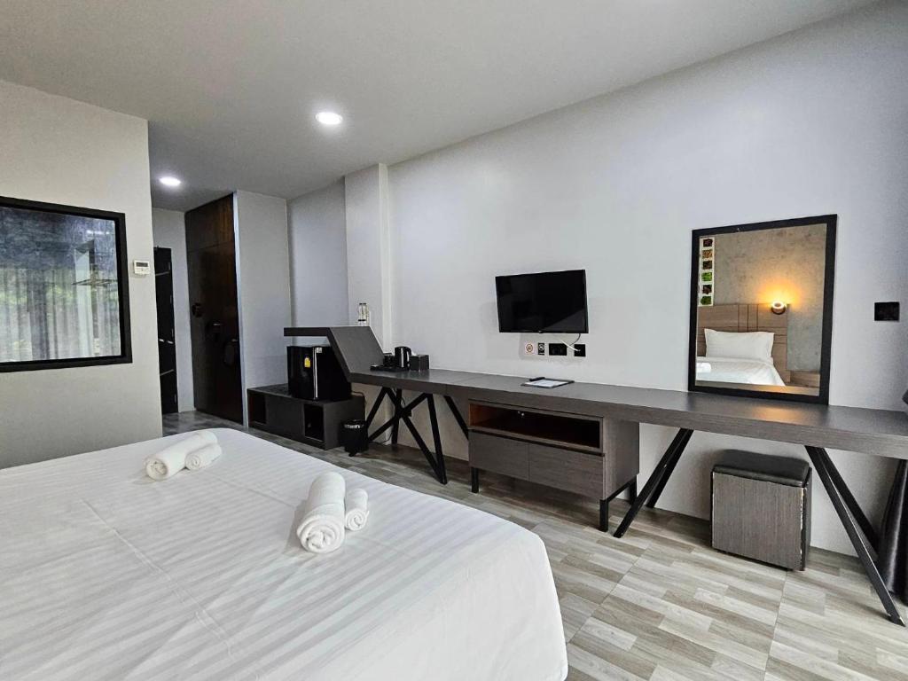Postel nebo postele na pokoji v ubytování Little Loft Hotel
