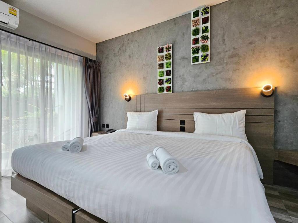 Postel nebo postele na pokoji v ubytování Little Loft Hotel