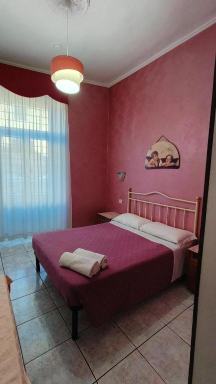 Postel nebo postele na pokoji v ubytování Hotel PRINCIPE AMEDEO