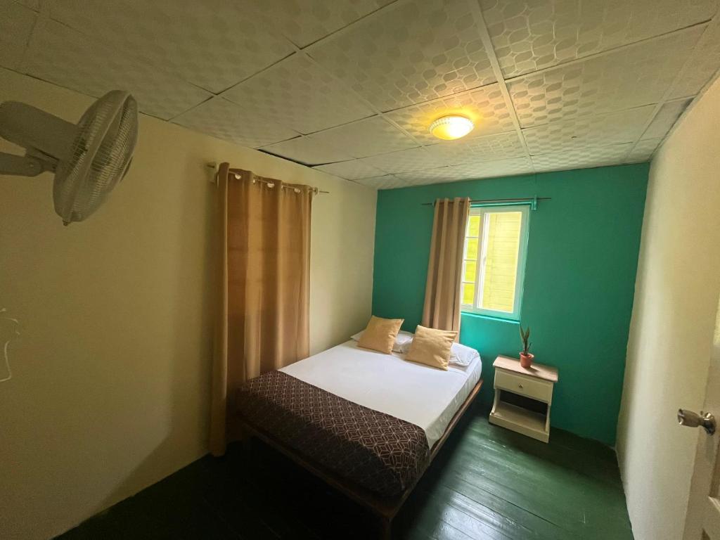 A bed or beds in a room at Hostal Cay
