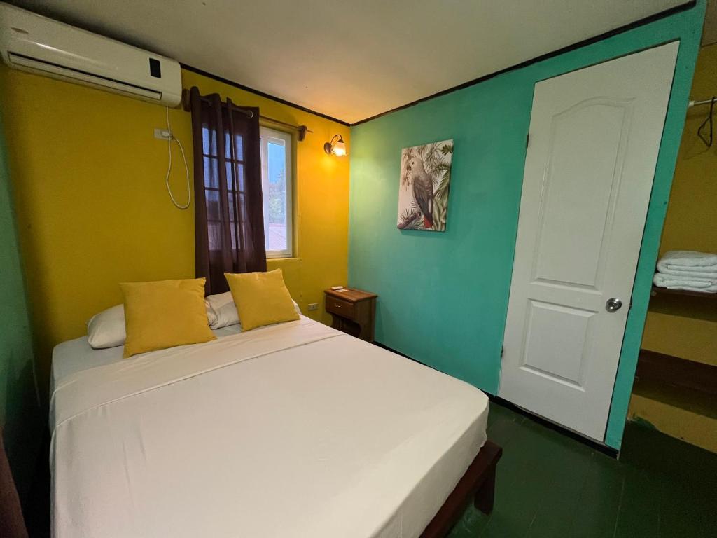 A bed or beds in a room at Hostal Cay