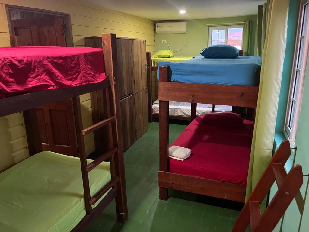 A bed or beds in a room at Hostal Cay
